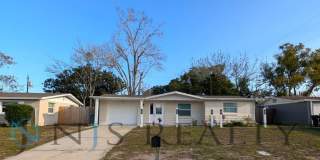 Fabulous 3/1/1 980 Sq. Ft. with NEW AC, NEW flooring, UPDATED kitchen  bath with GRANITE counters and HUGE backyard!!! Gallery 1