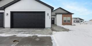 DARLING twin home located in Sugar City, Idaho 3 Bed 2 full baths with fully fenced yard and XL 2 stall garage Gallery 1