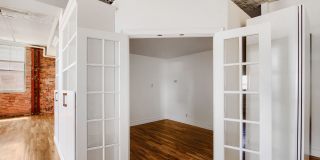 Evolve Real Estate: Bright Industrial-Style 1BD/1BA Condo in LoDo, Nearly 1,160 Sq Ft, Balcony and Rooftop Views! Gallery 8