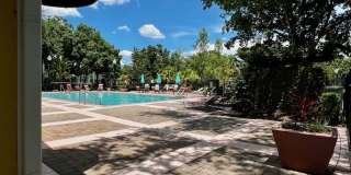 MOVE IN NOW!! Gated community Miriada! 1st floor 1X1.5 bath condo near pool area!!! Laminate wood flooring in living area and carpet in bedroom! Has washer & dryer! Gas stove & water heater! Gallery 38