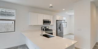 Charming 3-Bedroom Home with Modern Amenities inside a great community in Waddell, AZ Gallery 1