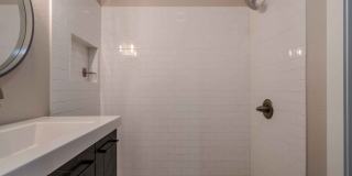 Completely remodeled like new Gingerbread midtown cottage with gleaming hardwoods, converted from a 3/1 to a 3/2. Gallery 39