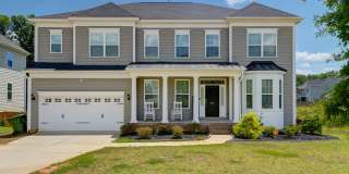 Welcome to 2286 Harvestwood Lane, a luxurious 5-bedroom, 4.5-bath home nestled in the serene community of Chapin! Gallery 1