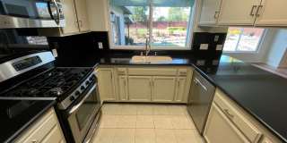 Spacious three bedroom home in desirable Windsor neighborhood! Gallery 21