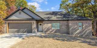 Modern open-concept living meets peaceful nature views in this custom-crafted retreat. Gallery 1