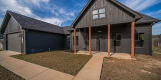 STUNNING modern farmhouse built in 2022 on 1 acre just outside the city limits of Tyler! Gallery 1