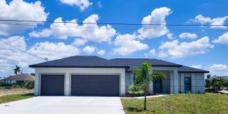 Brand-New Luxury Home with Office, 3-Car Garage & Designer Upgrades | Modern Living in Cape Coral! Gallery 1