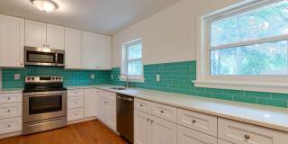 Discover the epitome of stylish living in this meticulously updated mid-century brick ranch, now available for rent. Gallery 12