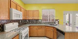 NW!! 4 Bedrooms!!! All Tile and Pergo flooring T/O!! NO Carpet!!! Low Maintenance Desert landscaping front and back!! With Patio cover in back!!! Gallery 23