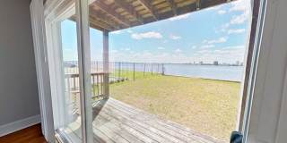 Riverfront Living! First Floor Unit w/ Private Patio, Stunning Views & Upgraded Kitchen Gallery 1