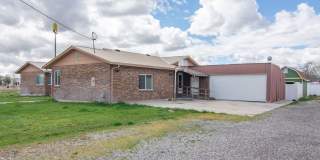 Spacious 3 Bed 2 Bath Brick Home with RV Parking, Shop Space & Large Yard in Tremonton! Gallery 3