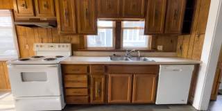 PRELEASING for AUGUST! Convenient Campus Living | 4BR with Fenced Yard & Covered Parking Gallery 1