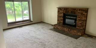 2 BR, 1.5 BA Clive split level duplex.  Deck and one car attached garage. Gallery 9