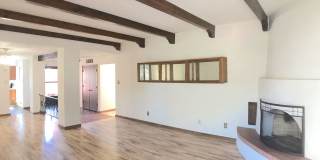 Spacious 2BR/2BA located on Golf Course in Rio Communities. Hardwood floors in living space. 2 Car Garage and Carport Gallery 1