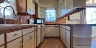 Bi-Level House w/ Massive Backyard, Storage, & Character! Gallery 11