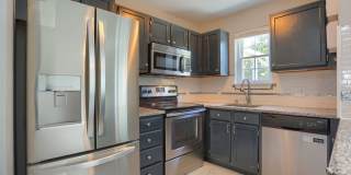 Updated Townhouse with Finished Basement, Fenced Yard & 2 Assigned Parking Spaces Gallery 1