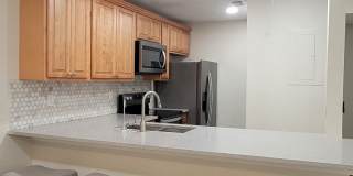 Light & bright and move in ready, updated townhome in Oakwood Villas. Gallery 8