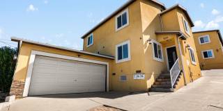 4 Bedroom / 3 Bath House with In-Unit Laundry & Private Garage! Gallery 1