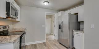 2 Bed/1 Bath just minutes from Augusta University and Surrey Center, featuring granite countertops, stainless steel appliances, and a private yard. Gallery 14