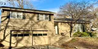 {7710} Prairie Village Split Level with Two Car Garage + Two Full Bathrooms + Hardwood Floors + Updated Kitchen with Granite and SS Appliances Gallery 1