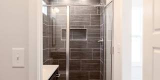 Modern Living Redefined with Stone Fireplace, Gray Cabinetry, Spa Inspired Primary Suite and Covered Outdoor Retreat Gallery 15