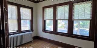 Large main floor duplex unit, Updated Kitchen & Bath, Full Dining Room w/Built-ins + Sunroom, garage stall Gallery 6