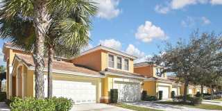 4BR/3BA Fort Myers Coach Home with Lake View & 2-Car Garage — $2,400/mo Gallery 1