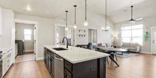 Bright and Modern Condo in Ideal Location with Detached Garage Gallery 1