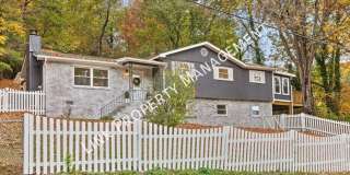 JUST REDUCE! Sophisticated Tri-Level Home in Stuart Heights — Modern Comfort  Timeless Charming 4 bedroom 3 baths with partial basement Gallery 1