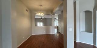 Single-level 3-bedroom home in a desirable Chandler location featuring a 2-car garage and tile roof and wood plank flooring throughout Gallery 9