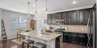 Like new gorgeous ground level Condo with Detached Garage and open floor plan. Gallery 15