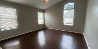 Single-level 3-bedroom home in a desirable Chandler location featuring a 2-car garage and tile roof and wood plank flooring throughout Gallery 21