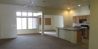 Huge family room with kitchen nicely tucked in the middle. Gallery 11