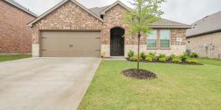 Discover seamless fusion of stately brickwork and modern comfort in this Caddo Mills home. Gallery 1