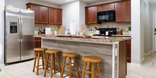 2 car garage with lighting, granite countertops. Backyard includes a custom extended concrete patio perfect for gatherings Gallery 16