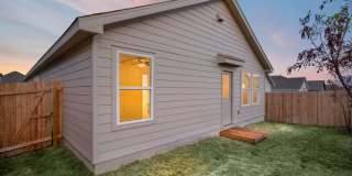 This beautiful single-story home has 4 bedrooms, 2 baths, vinyl flooring throughout, an open floor plan Gallery 26