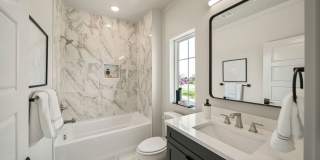 Discover modern elegance in the newly constructed Edgewater Condominiums, a boutique community featuring 18 luxurious units with 9 still available for purchase. Gallery 27