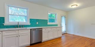 Discover the epitome of stylish living in this meticulously updated mid-century brick ranch, now available for rent. Gallery 14