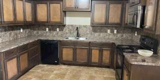 3 bed 2 bath 2 car garage in Chickasha! granite, luxury vinyl and ready for move in! Gallery 1