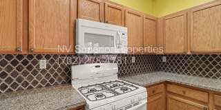 NW!! 4 Bedrooms!!! All Tile and Pergo flooring T/O!! NO Carpet!!! Low Maintenance Desert landscaping front and back!! With Patio cover in back!!! Gallery 21