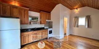 Quaint cottage with hardwood floors, private entrance and patio, surrounded by lush gardens! Gallery 1