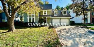 Fantastic Lenexa Home w/ Updated Kitchen, Wood Floors, Spacious Bedrooms, Finished Basement and a Spacious Yard! Gallery 1