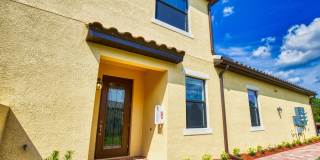 Annual Unfurnished Rental – Coach Home 3 Bedrooms, 2 Baths, 2 Car Garage, with Resort Like Amenities – Gran Paradiso Community! Gallery 1