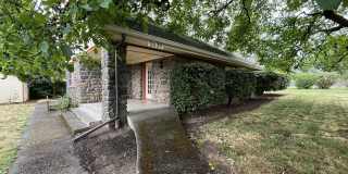 Charming Cottage Home with Timeless Character, Hardwood Floors, Flexible Living Spaces, and Expansive Yard Gallery 1