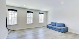 Welcome to this beautifully designed 3 level townhome in Westphalia Town Center Community! Gallery 6