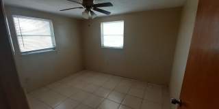 JUST REDUCED!!! 2/1.5/1 1000 Sq. Ft. NEW AC!!!Spacious living room, Lanai, fenced in yard, and tile floors thoughout! Gallery 6