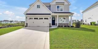 Discover this new spacious 4-bedroom, 3.5-bath home in Grayson Park Gallery 1