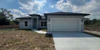 MODERN BRAND NEW 4BD/2BA RETREAT IN LEHIGH ACRES! Gallery 1