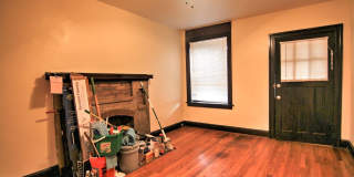 This 2 bedroom 1 bath home has been completely refinished with brilliant hardwood floors throughout! Gallery 10