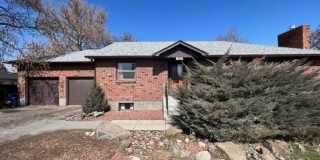 Bi-Level House w/ Massive Backyard, Storage, & Character! Gallery 1